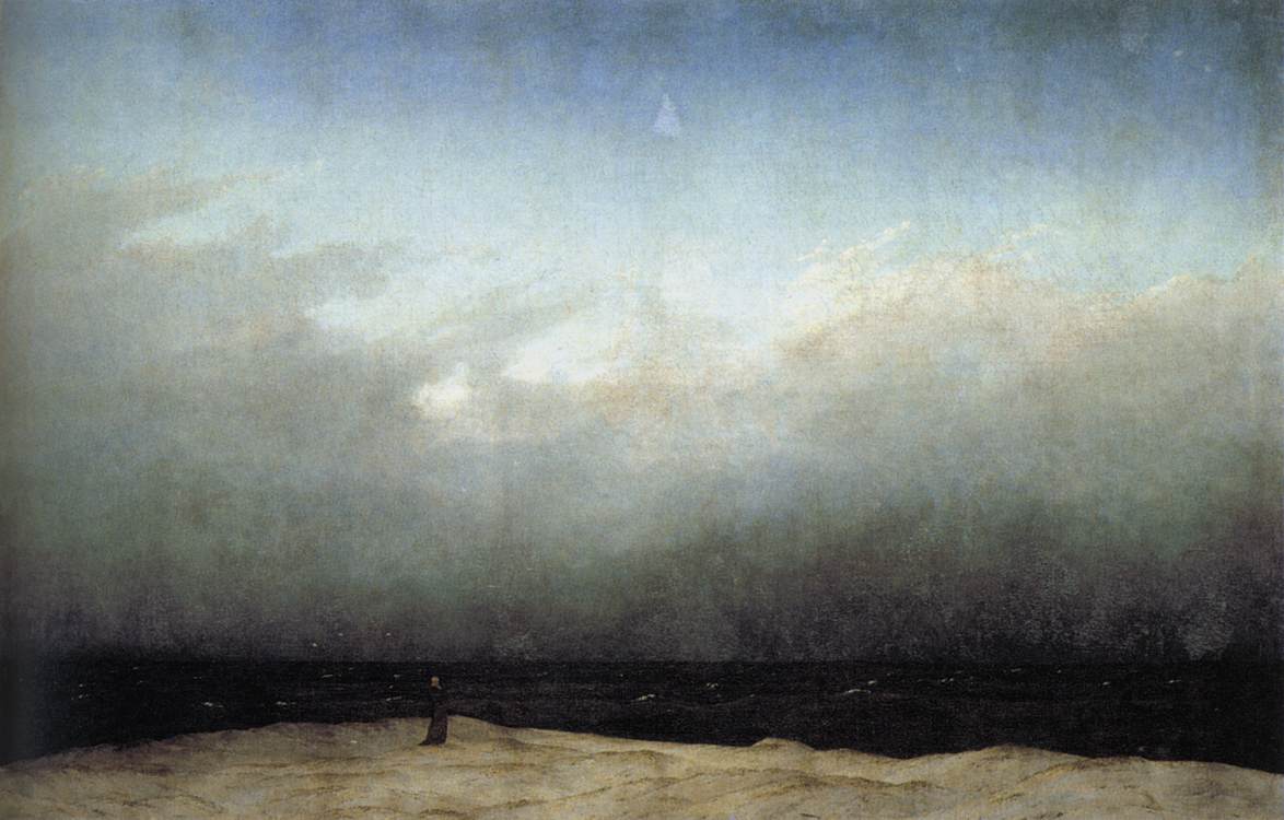 Nel quadro ad olio di Caspar David Friedrich in un'atmosfera cupa una figura spettrale inriva al mare guarda il mare.